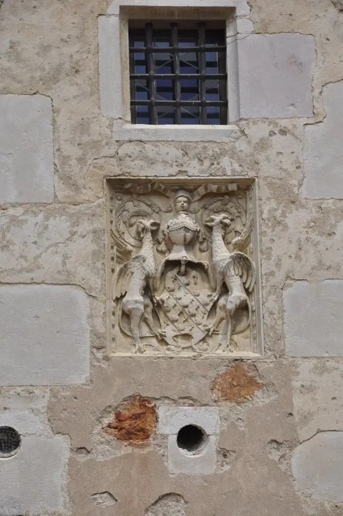 Coat of arms carved in stone at Château de Corcelles-en-Beaujolais