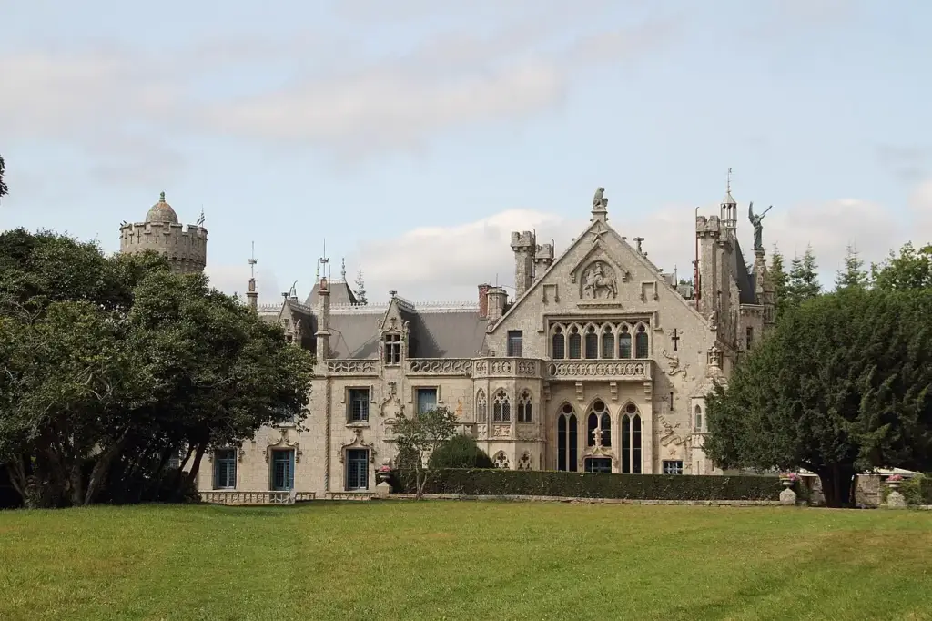Gothic Revival façade of Château de Kériolet facing the lawn