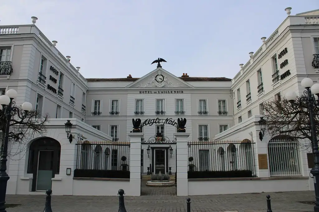 Main façade and entrance of the Aigle Noir hotel in Fontainebleau, photographed in 2020.