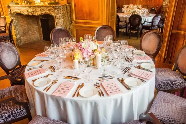 Reception table set in a wood-panelled room at Château de Fère