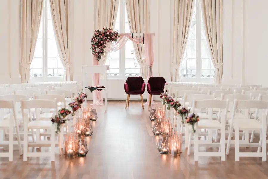 Wedding ceremony arrangement with white chairs at Wereldmuseum Rotterdam