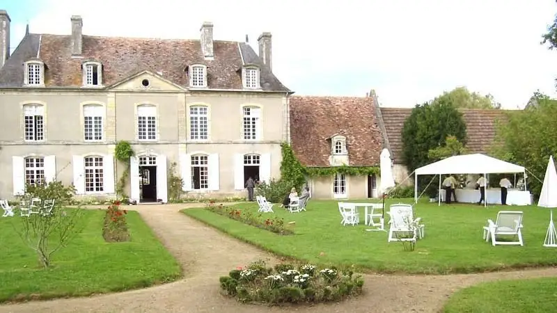 Façade of Château de Merville in Calvados, with a reception in the garden