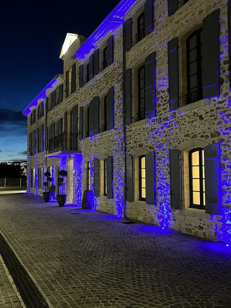 Stone façade of Hôtel 1770 in Le Pontet, illuminated at night