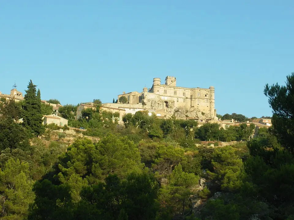 Stone towers of Château du Barroux above the village rooftops in Vaucluse