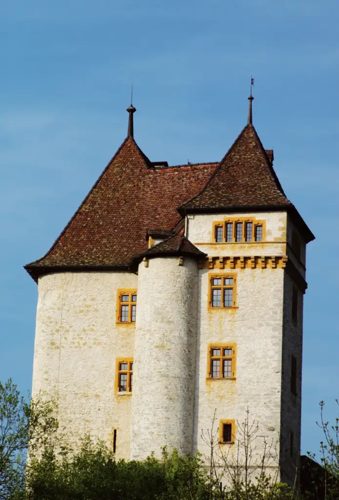 South façade of Château de Valangin with its turret and tiled roofs