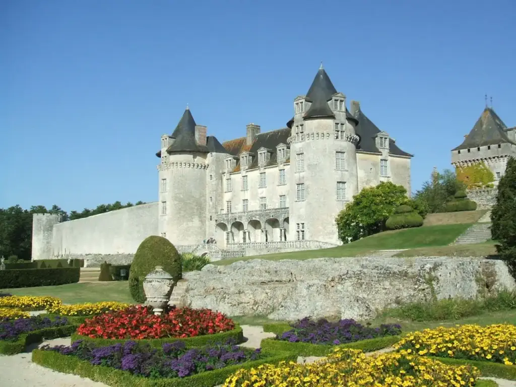 Flower gardens and façade of Château de La Roche Courbon in 2009