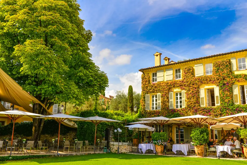 Garden, terrace and facade of La Bastide Saint-Antoine in Grasse