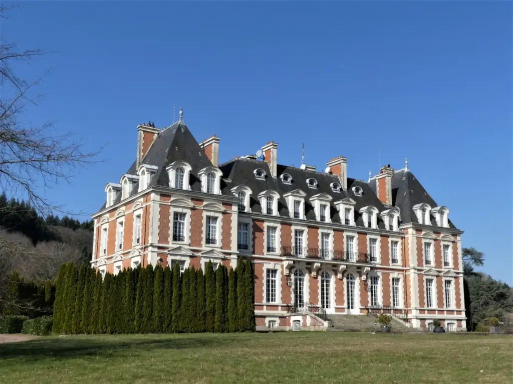 Authentic exterior view of Château de la Cazine in Noth, Creuse