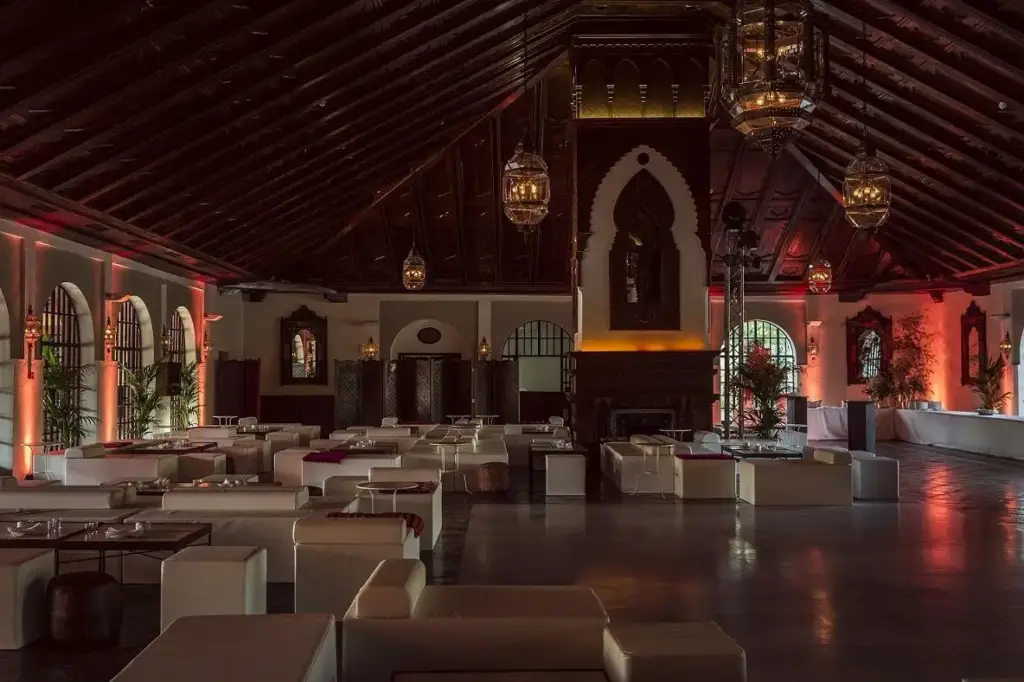 Salón Vizir with its timber ceiling, large windows and reception furniture