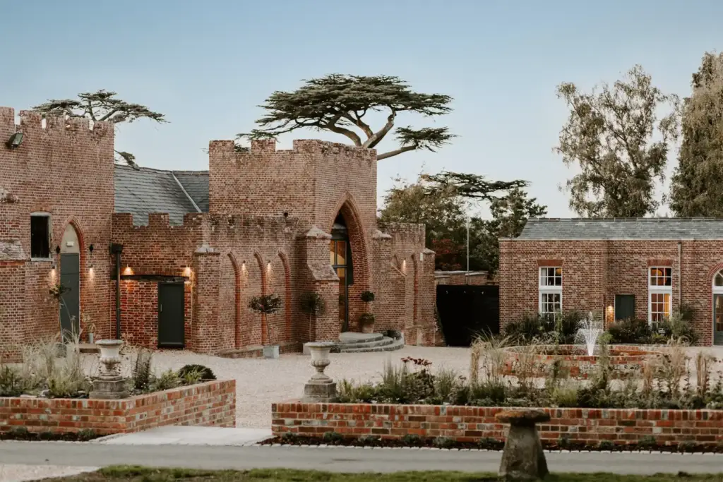 Castle Barn exterior and reception courtyard at Wasing Park
