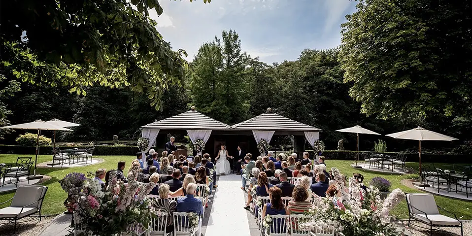 Wedding ceremony seating in the garden at Kasteel de Wittenburg