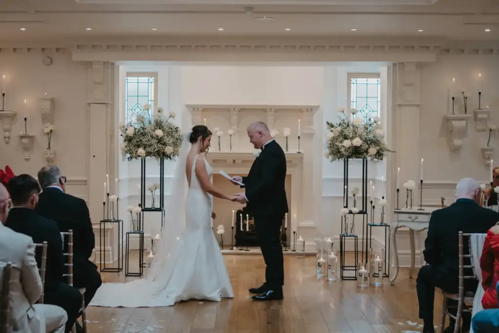 Wedding ceremony in the light-coloured ceremony room at Ashfield House