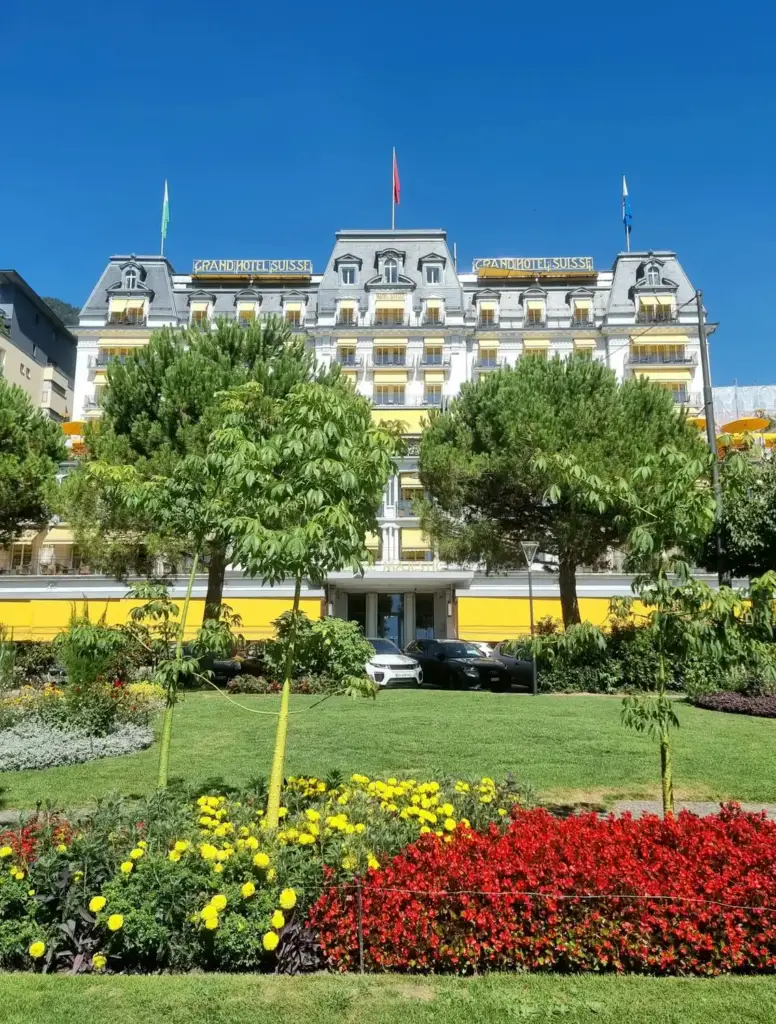 Façade of Grand Hotel Suisse Majestic and flowerbeds in Montreux