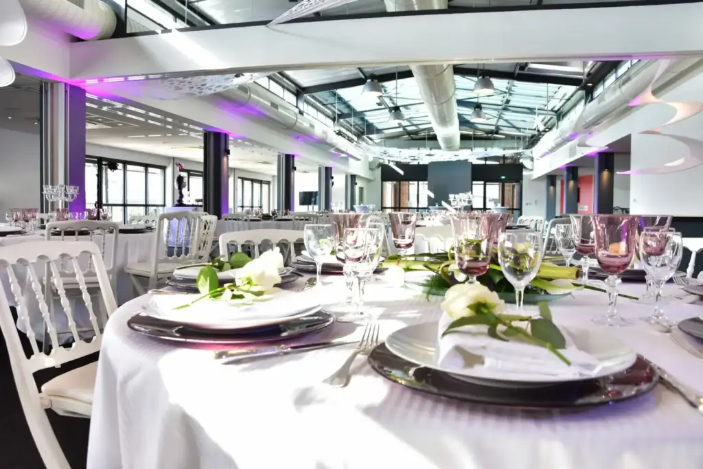 Tables set for a reception in the main Vue sur Seine event room in Rouen