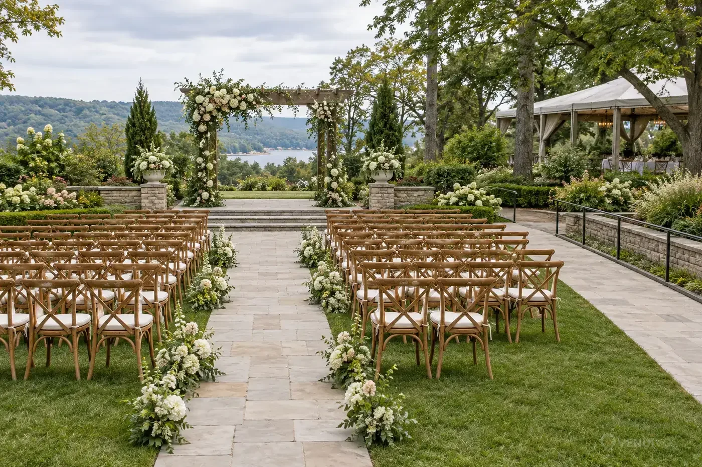 Aisle and rows of chairs arranged for a secular ceremony in a garden